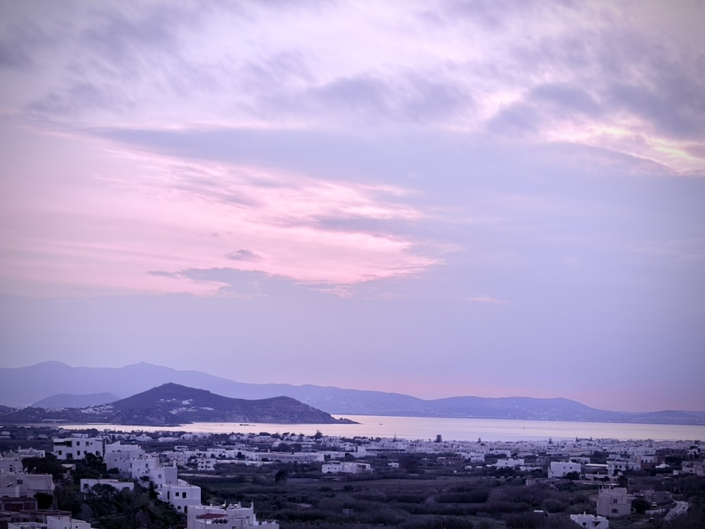 A dusk view over Naxos in pale violet and pink.