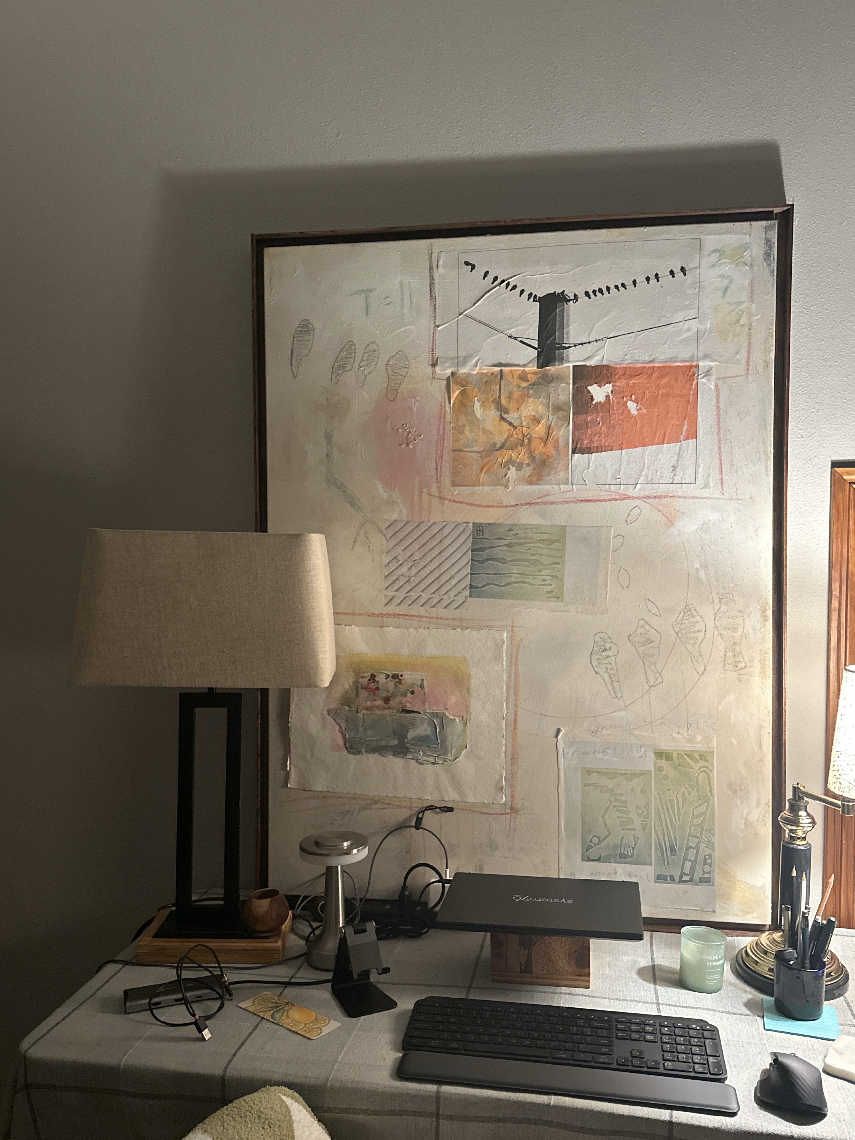 Jo Van Arkel mixed-media work resting above a desk and lamp