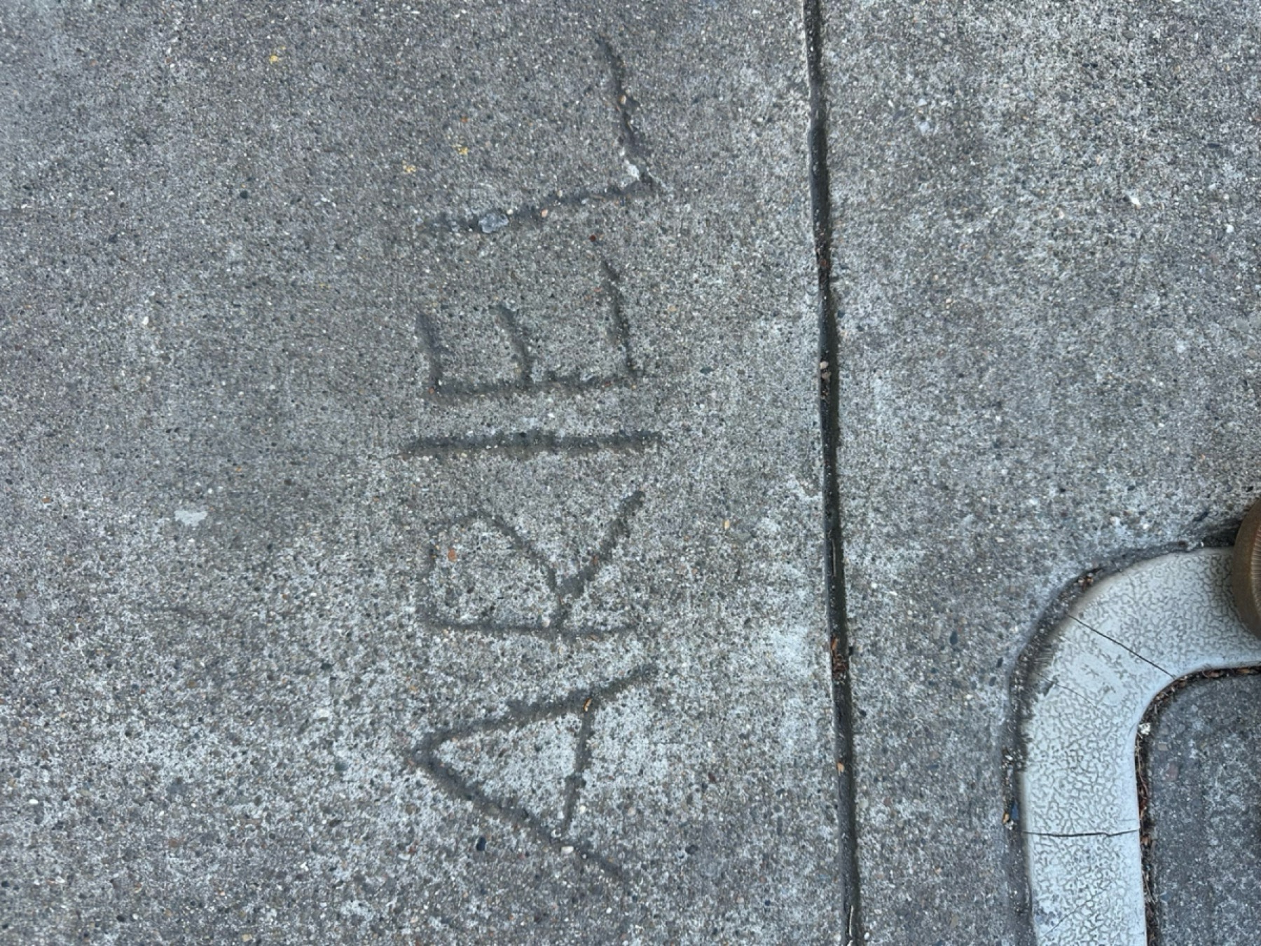 Ariel written into a sidewalk